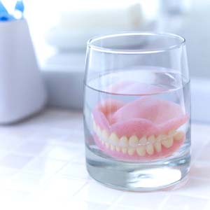 Dentures in Fort Worth soaking in solution