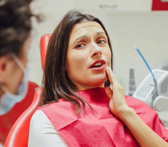 A patient talking to her dentist about root canal therapy