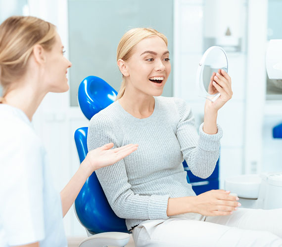 a patient visiting their cosmetic dentist in Fort Worth
