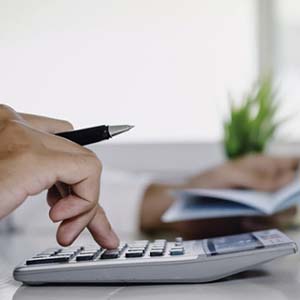 Man calculating cost of dentures in Fort Worth