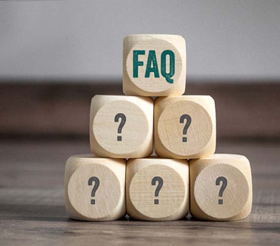 Pyramid of wooden blocks with question marks on them