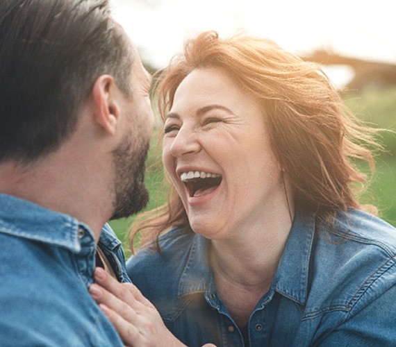couple laughing together outside