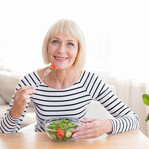 Woman eating salad in Fort Worth