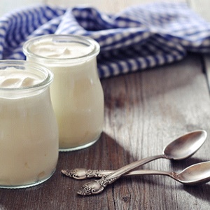 Two jars of yogurt, a no-chew food, on table