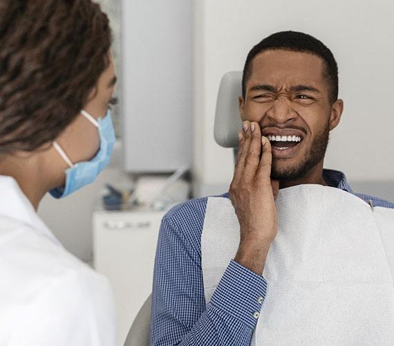 Man with tooth pain in Fort Worth