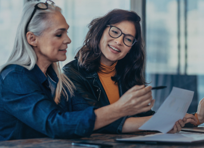 Two people looking at dental insurance information