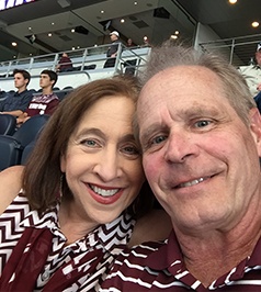 Doctor McConnell and his wife at a sporting event