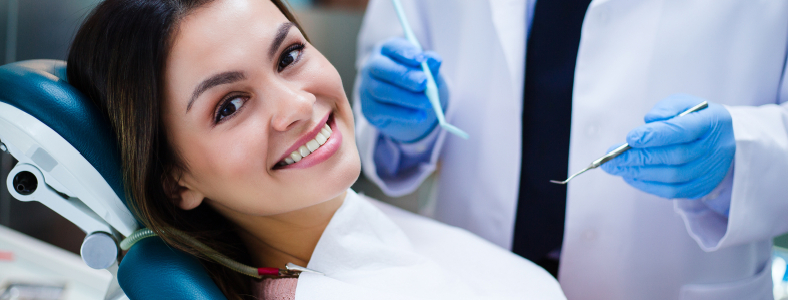 Woman smiling during preventive dentistry checkup