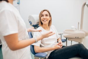 woman with autoimmune disease talking to her dentist about dental insurance 