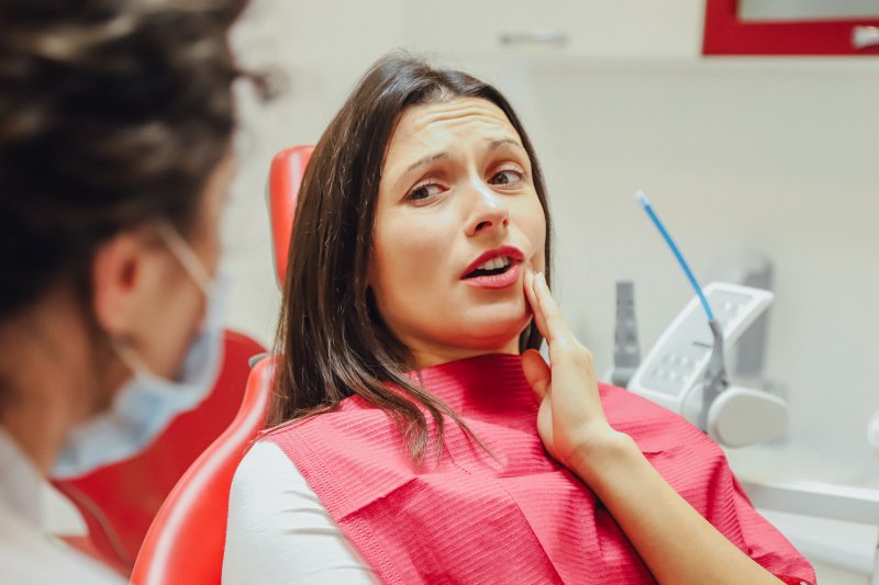 A young woman about to receive a root canal