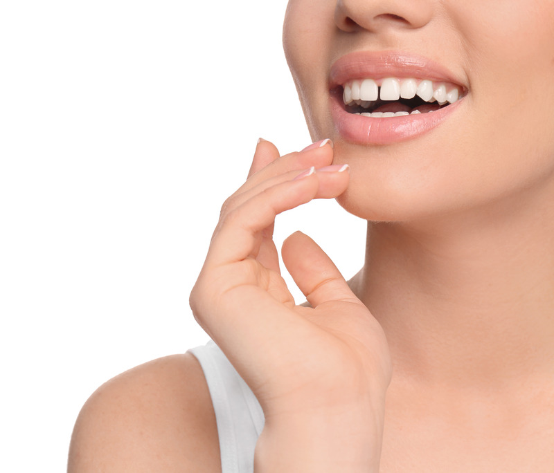 Patient smiling with a gap in her smile before cosmetic dentistry