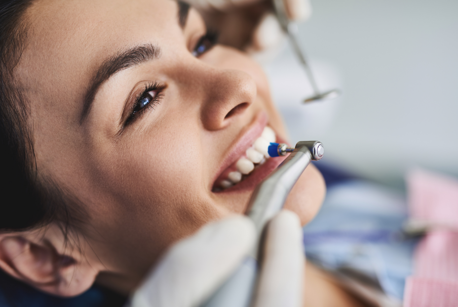 Woman undergoing dental cleaning