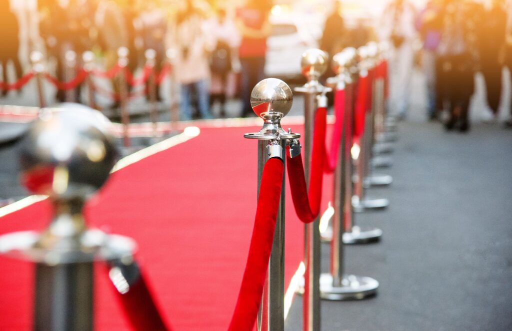 Red carpet surrounded by photographers